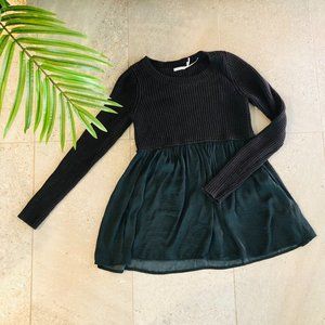 Black sweater tunic with mid-waist green flare